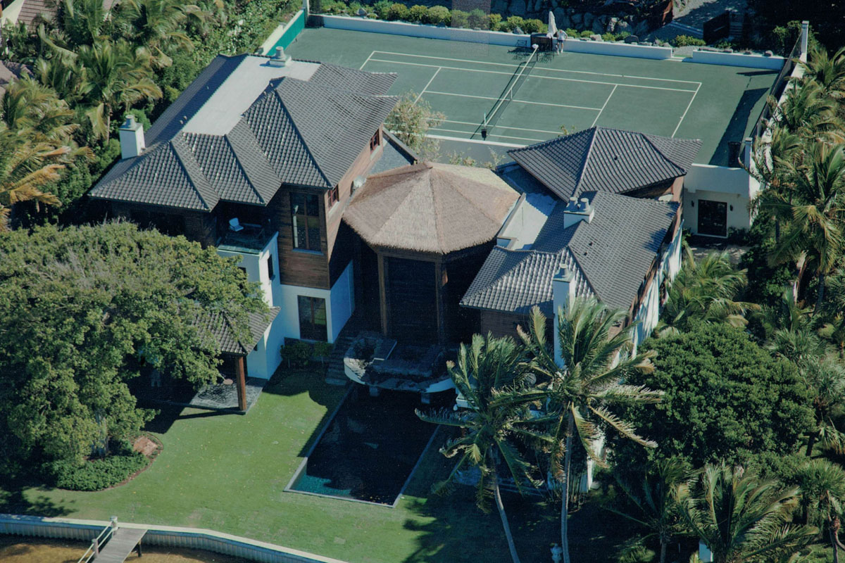 large home with tennis court